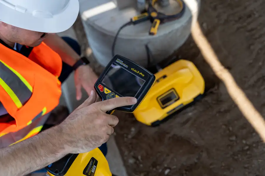 Technician reading a locator